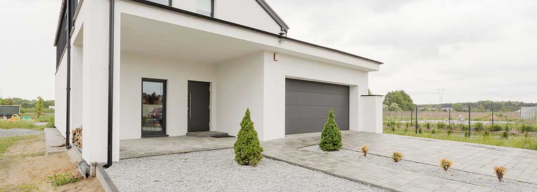 A photo of a two-storey house with a wide entrance and carport. Houses usually are part of the Conjugal Property.