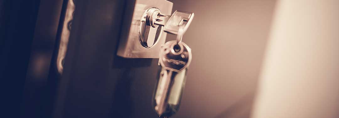 A set of silver keys with one inserted in the lock of a door to indicate a Spouse leaving the Conjugal Home. Article: A simpler way to divide Conjugal Property by Lawyers in the Philippines 