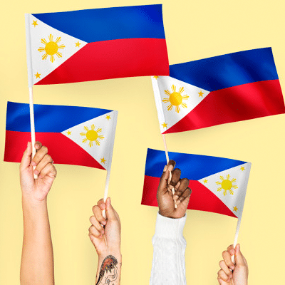Hands waving Philippine flags