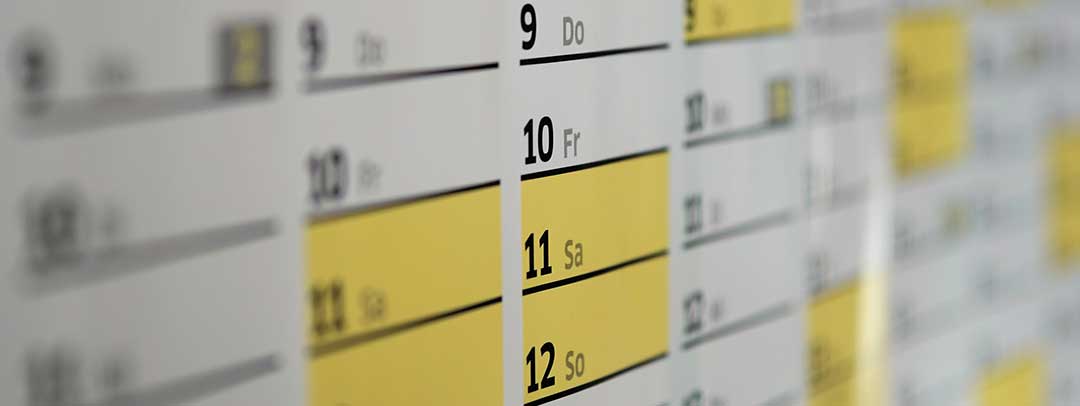 A photo of  a calendar with dates highlighted in bright yellow. A Recognition of Foreign Divorce in the Philippines can take about 1 and a half years to conclude