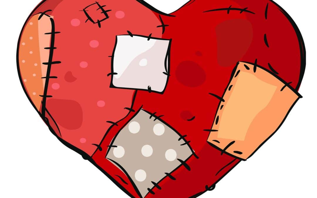 A heart with stitches and patches