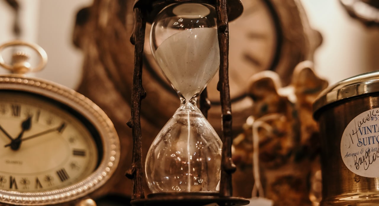 A photo of clocks and an hourglass indicating that a case of Legal Separation in the Philippines must be filed within a 5 year timeframe. 