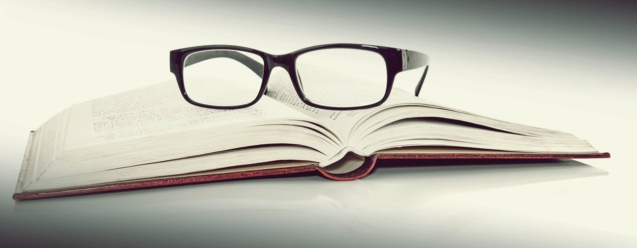 Book and eyeglasses