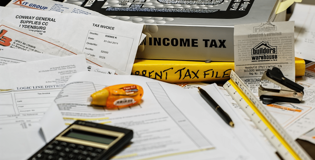 Books, calculator and income tax papers for filing