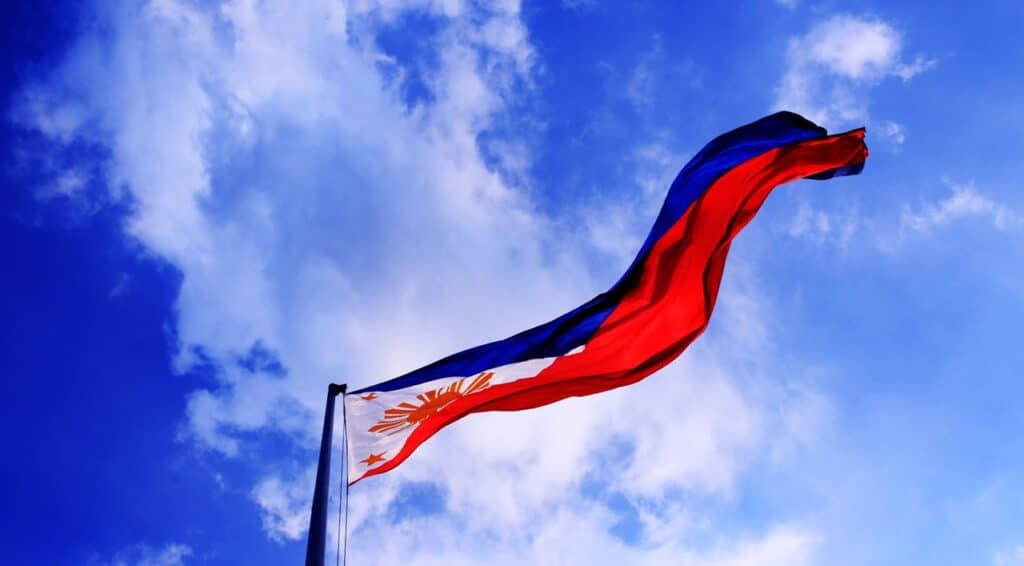 A Philippine flag under a bright day