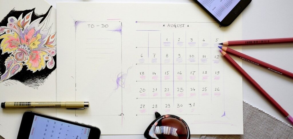 Calendar and pens on the table