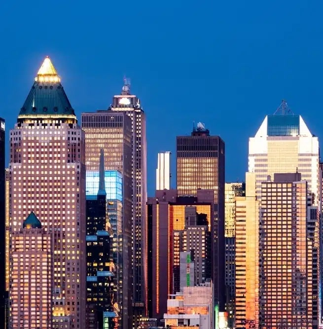 A picture of city buildings at night