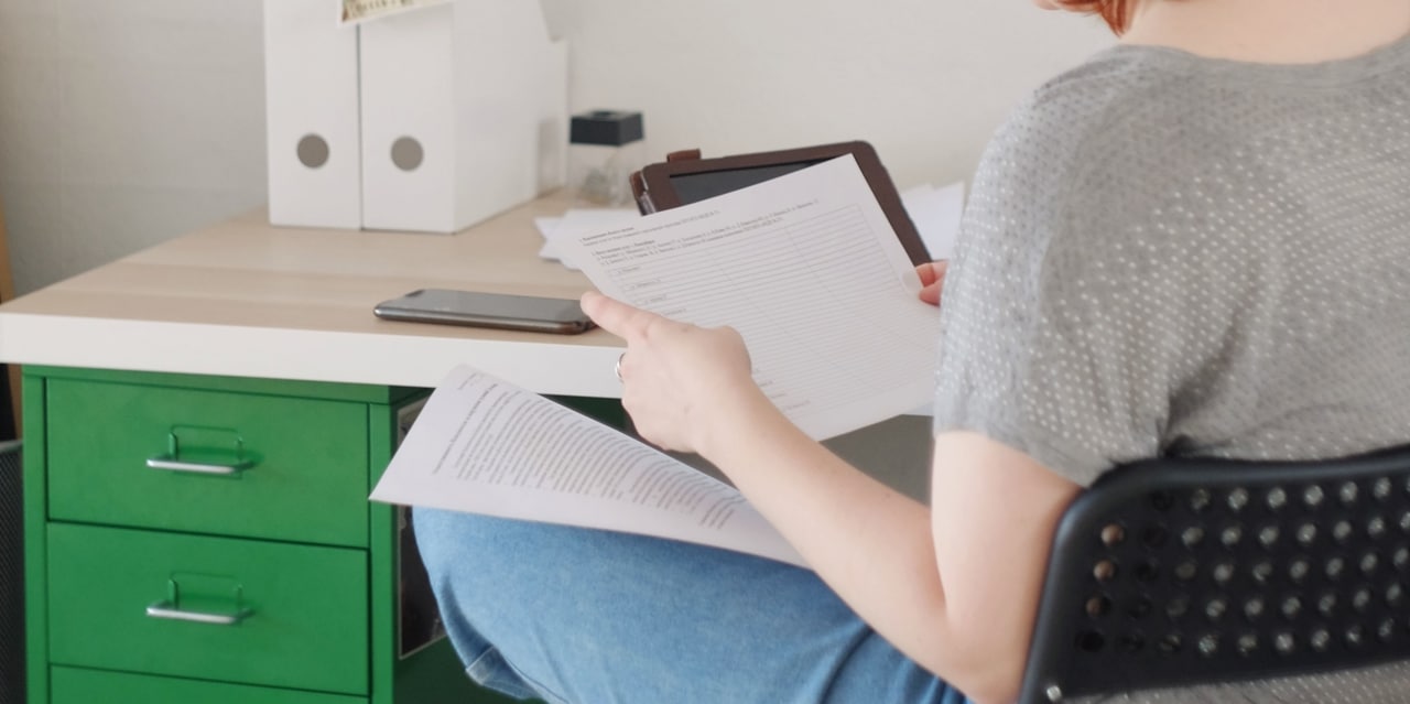 A lady reading a document