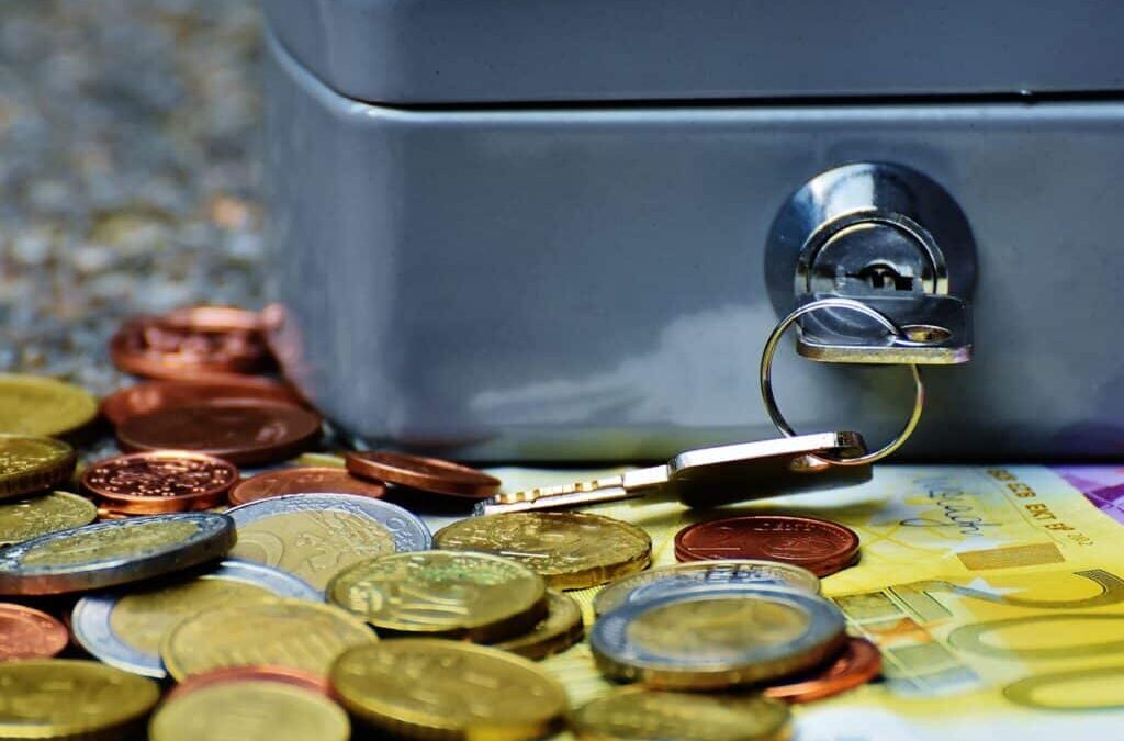 Coins and bills beside a locked vault box symbolizing Corporate Bank Account in the Philippines