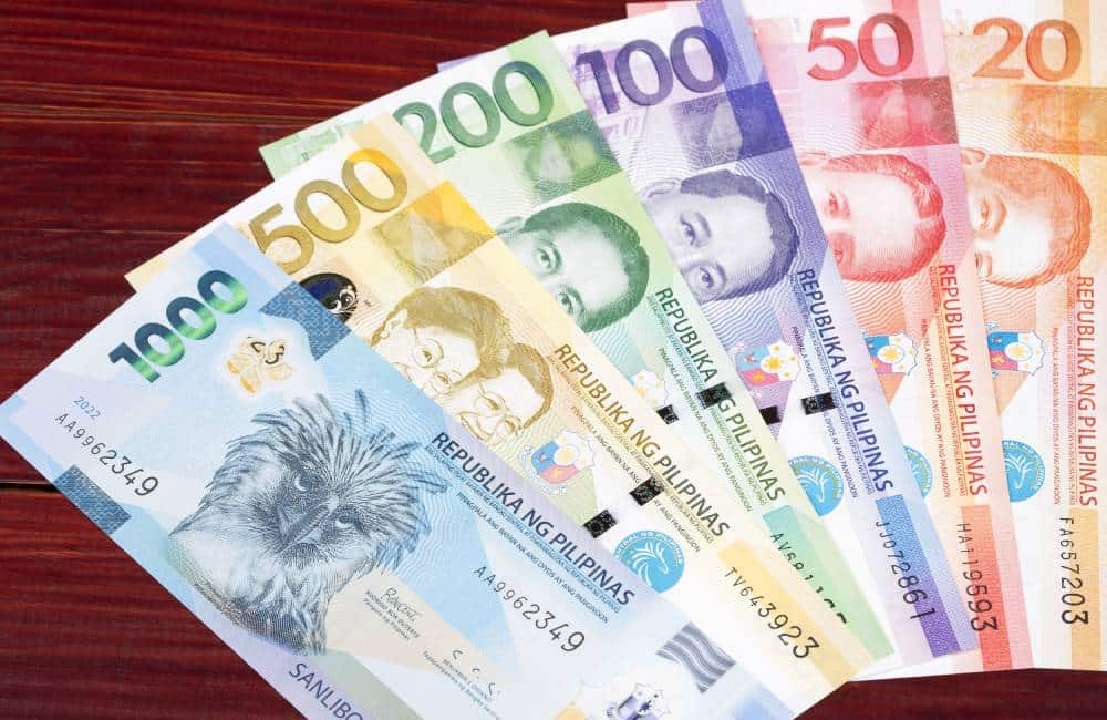 A photo of Philippine bank notes as an indication of the capitalization cost and fees of an SEC Registration of a Branch.