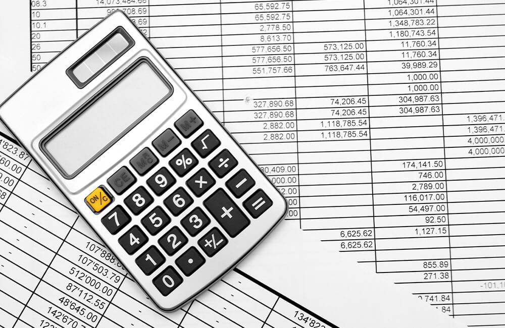 A calculator on top of financial documents.An Estate with a lot of assets may need a Holding Company or just a Will. It depends on the situation. 