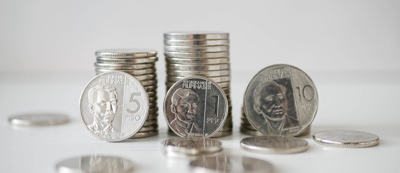 Three stacks of Philippine Peso coins