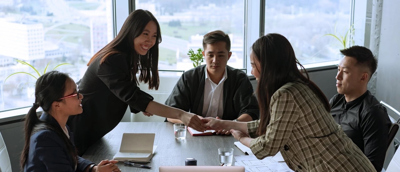 Group of people having an agreement in an office