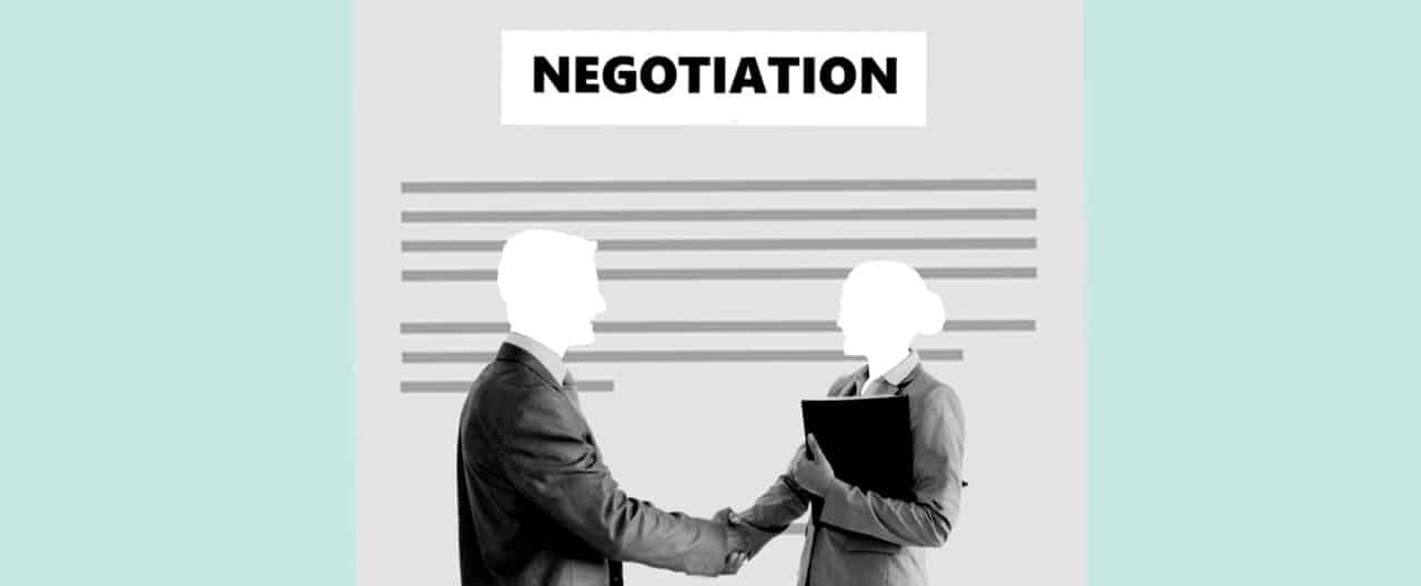 Two people shaking hands after a negotiation