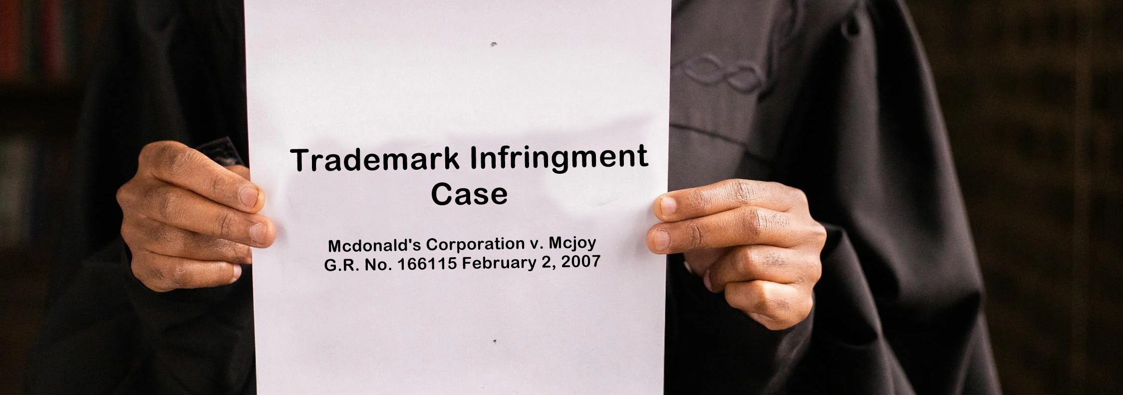 A woman holding a print out of an infringement case