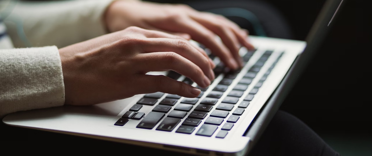 A person on her computer drafting an articles of incorporation of a non-profit organization in the Philippines