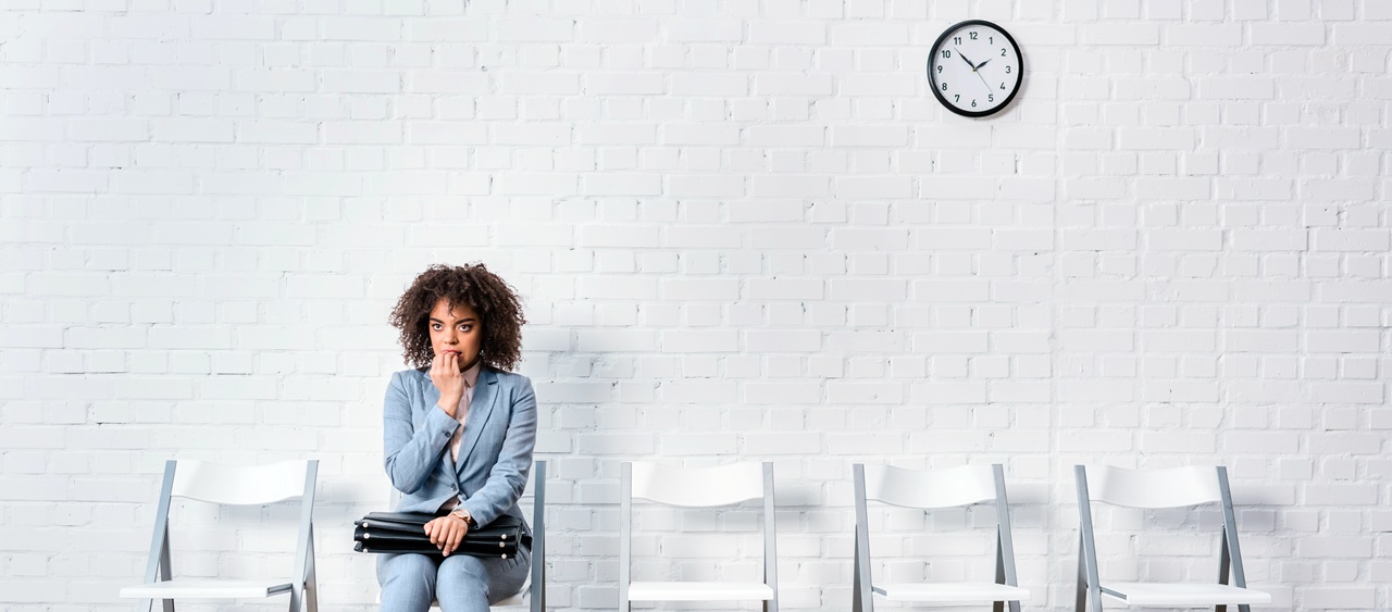 A woman sitting on a waiting area