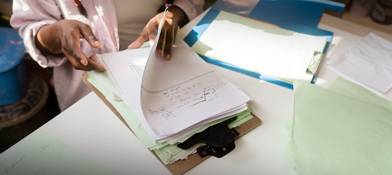 A woman checking her paper works