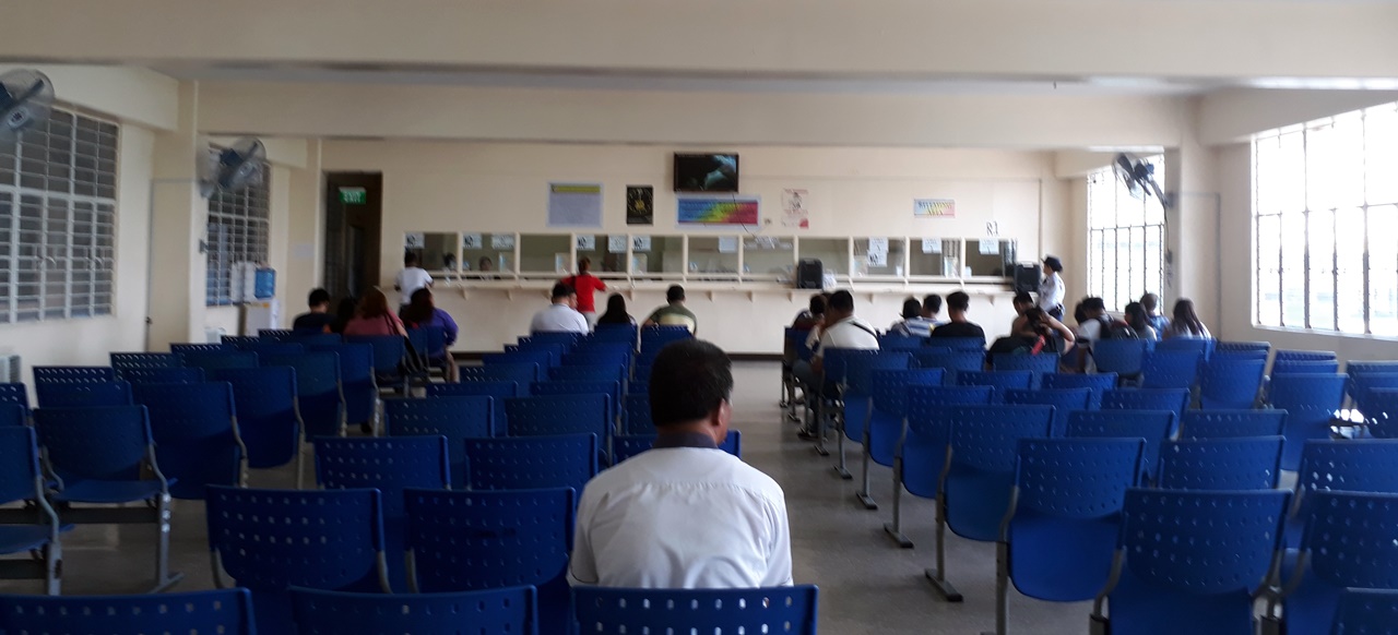 A man waiting his turn in a government office