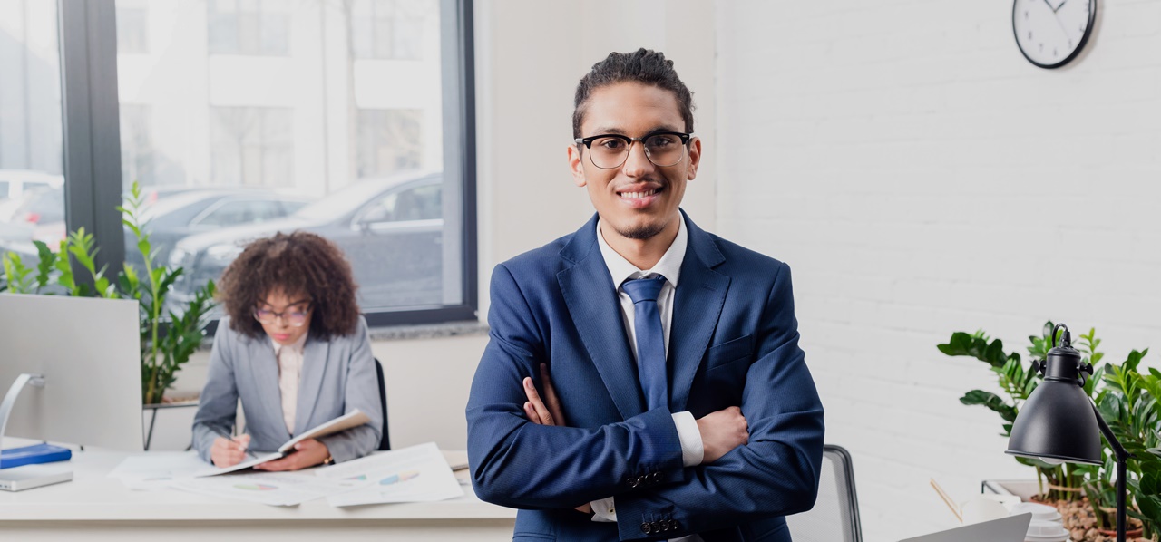 A corporate man smiling on the camera