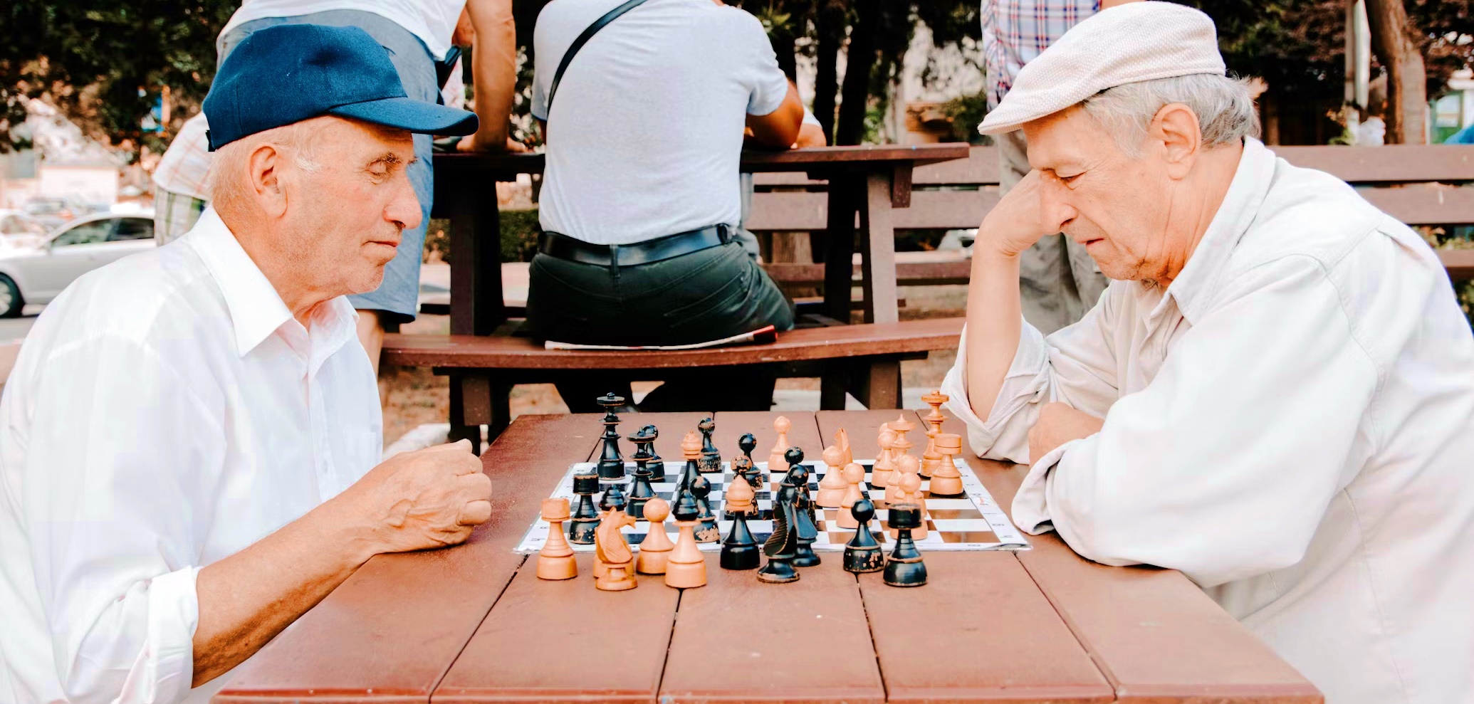 Two elderly men playing a chess game on a park symbolizing a foundation non-profit organization in the Philippines.