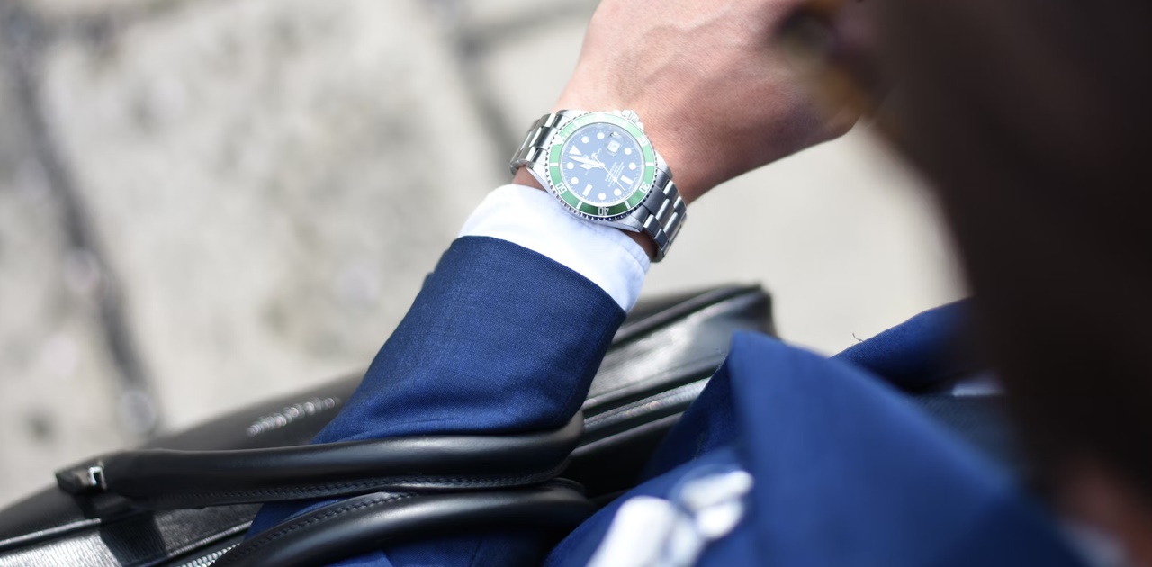 A busy man looking at his wristwatch