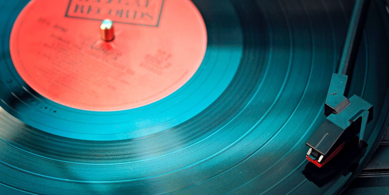 An analogue record disk being played