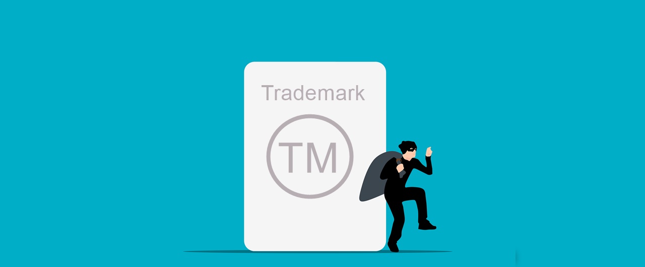 A trademark thief stealing a trademark with a logo on his back, as trademark infringement is becoming more and more common.